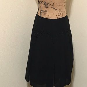 Black-lined Skirt with 6 embroidered panels.